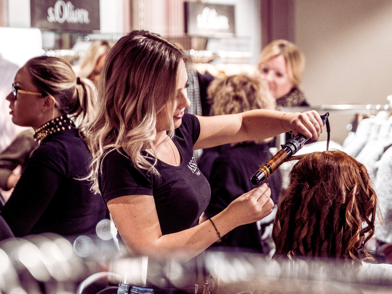 Salon hairstyling session with hot tools – excessive heat styling linked to breakage and weak hair strands