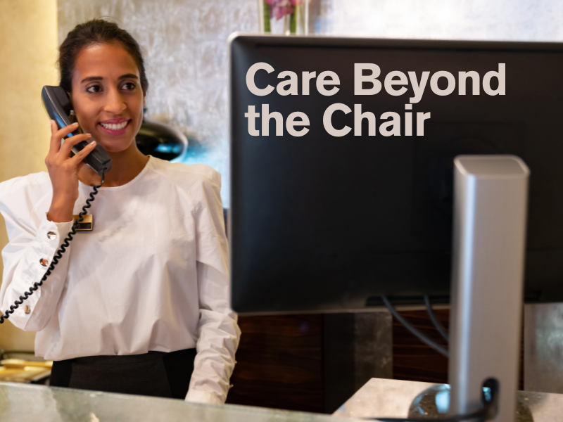 Salon front desk staff delivering warm customer care—ideal for promoting client communication, follow-up service, and luxury salon experience.