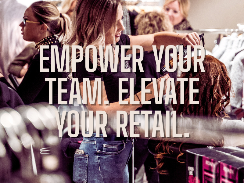 Salon professional styling hair with busy team in background—ideal for content on boosting retail sales, empowering stylists, and salon business growth.