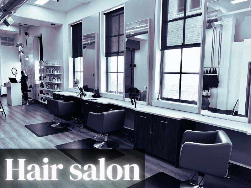Professional salon space with styling stations and clean, minimalist design for client services.